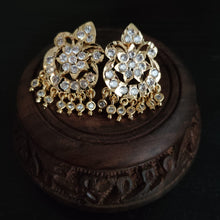 Impon earrings with red and clear gemstones