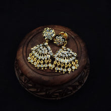 Impon Ornate gold earrings with gemstones