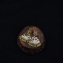 impon earrings with gemstones