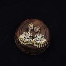 impon earrings with gemstones