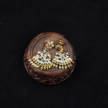 impon earrings with gemstones