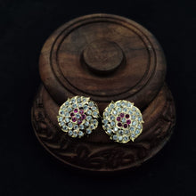 Impon ornate earrings with gemstones