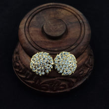 Impon ornate earrings with gemstones
