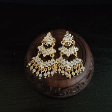 Impon Ornate gold earrings with gemstones