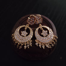impon earrings with full gemstones