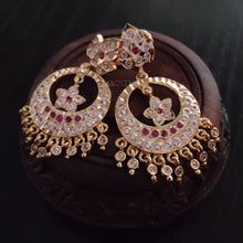 impon earrings with full gemstones