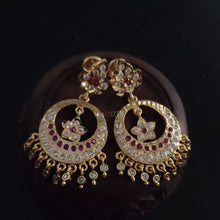 impon earrings with full gemstones