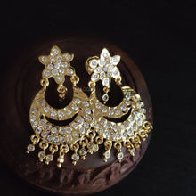 impon earrings with full gemstones