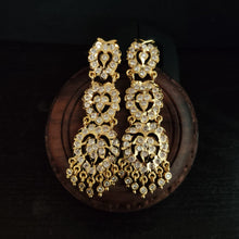 impon earrings with gemstones