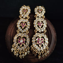impon earrings with gemstones